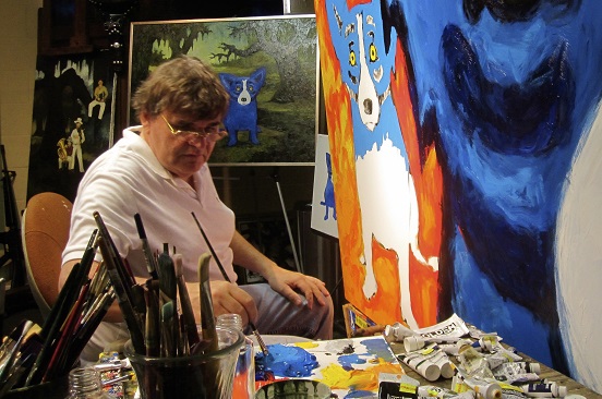 George Rodrigue painting the blue dog