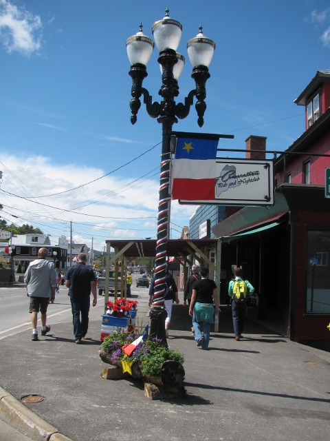 Flag in decorated street at Congres Mondial Acadien