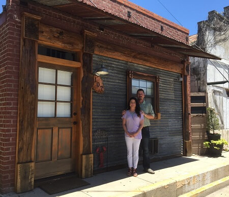 Mickey and Tiffany Bellott in front of their Bayou Chateau B&B in New Iberia.
