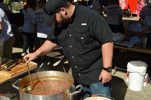 Serving gumbo at World Championship Gumbo Cookoff