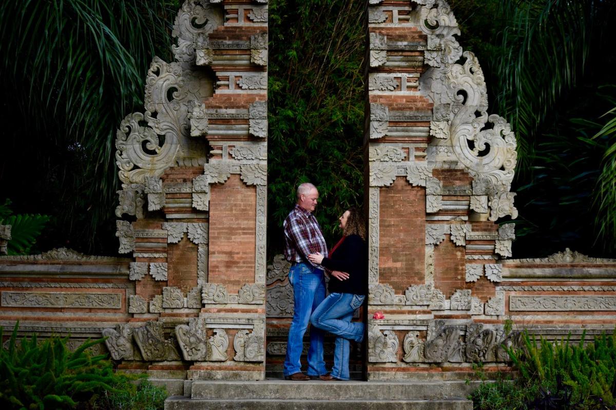 Couple at Balinese Gates at Jefferson Island Rip Van Winkle Gardens