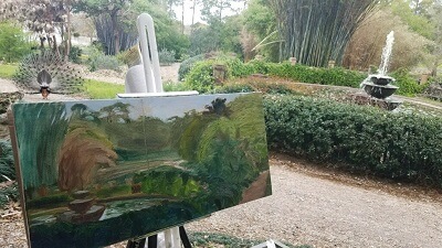 Painting of Rip Van Winkle Gardens by Peggy Usner shown with a peacock in the middle of the gardens at Shadows on the Teche Plein Air Competition